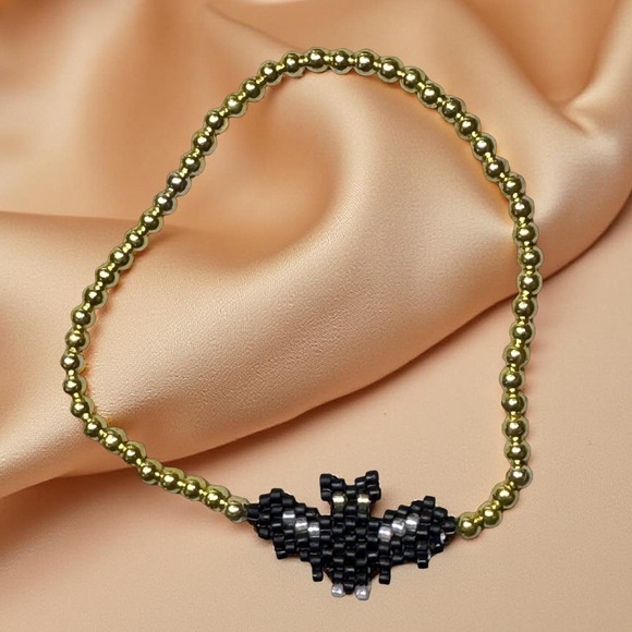 Handcrafted Black and Gold Beaded Bat Stretch Bracelet - Picture 1 of 5